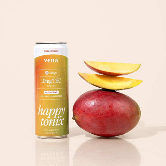 Vena mango Happy Tonix can (10mg THC, 5mg CBD) beside whole mango topped with two mango slices