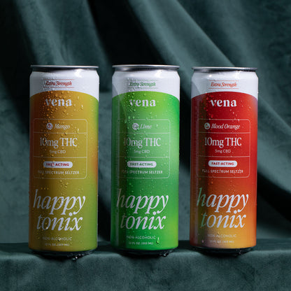 Three chilled Vena 'happy tonix' seltzer cans — Mango (yellow), Lime (green), Blood Orange (red) — with water droplets.