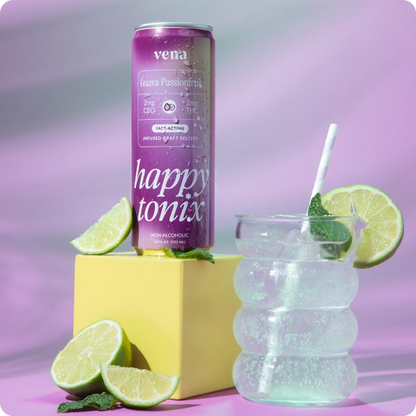 Purple can reading 'vena', 'Guava Passionfruit', 'happy tonix', 'non-alcoholic' beside a bubbly glass and lime wedges.