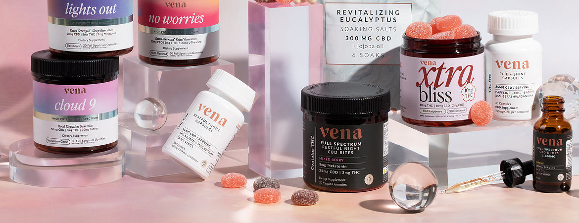 Front view of three open Vena gummy jars showing sugar-coated Delta-9 full-spectrum gummies and colorful labels on a pearlescent display