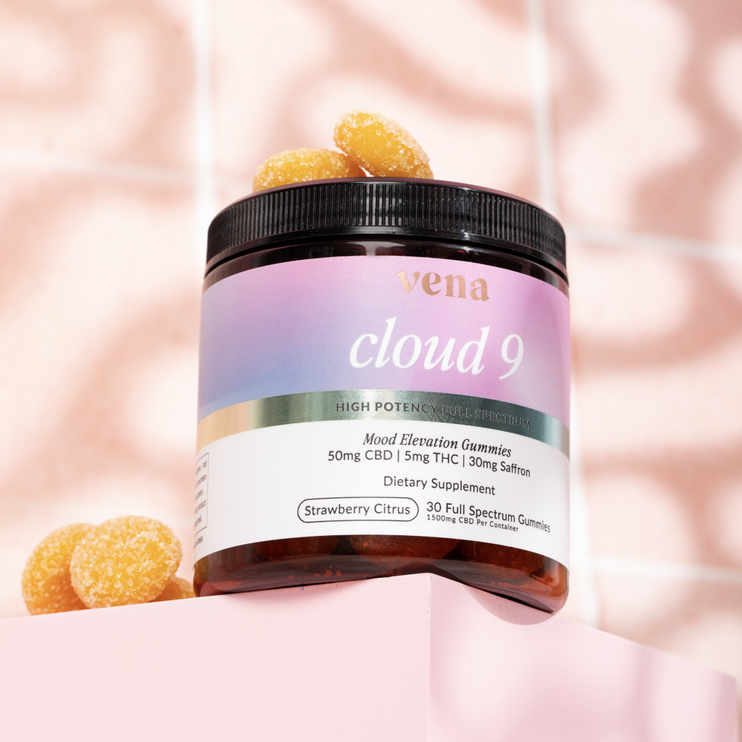 Vena Cloud 9 jar of Strawberry Citrus mood elevation gummies with sugar-coated yellow gummies on a pink pedestal.