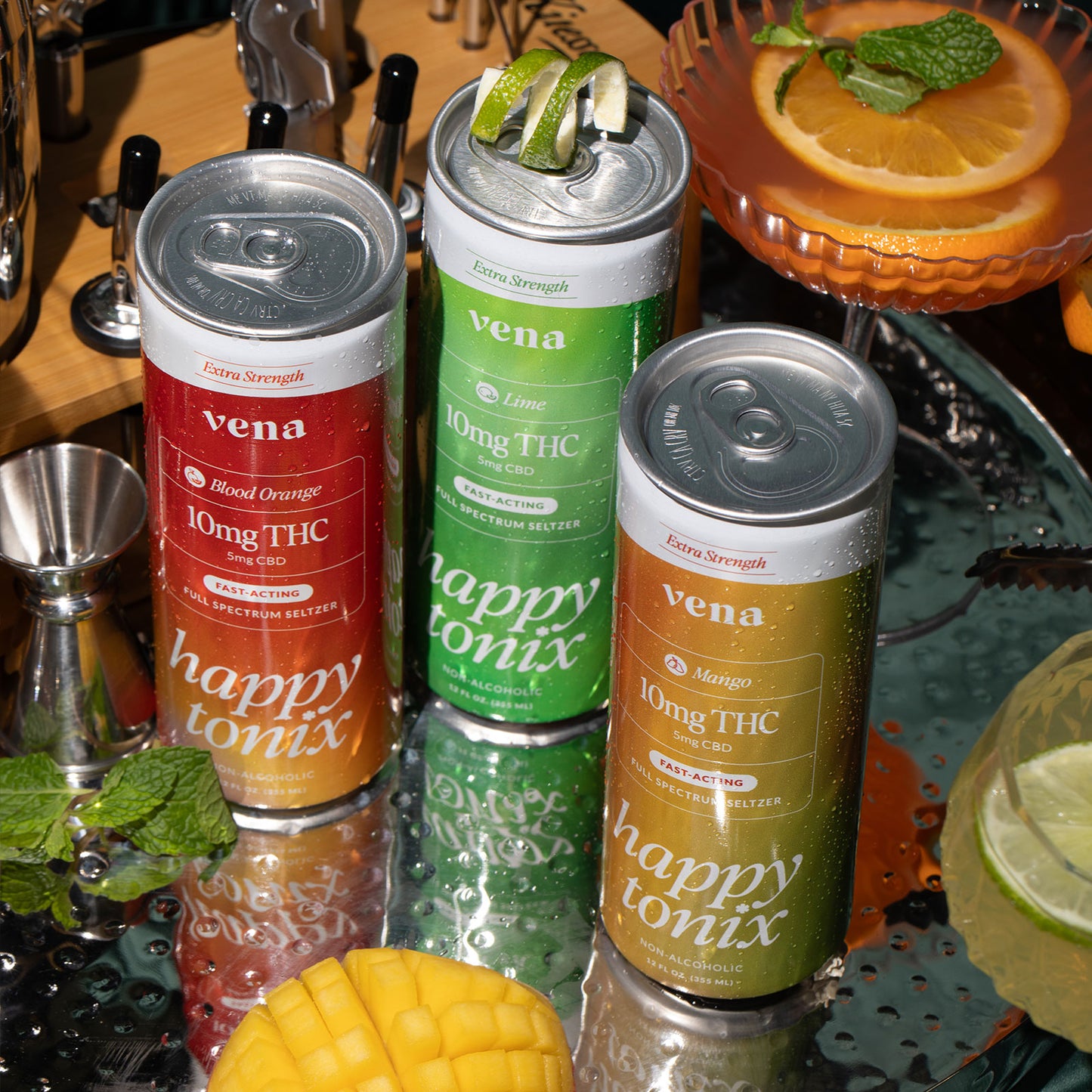 Three Vena cans labeled Blood Orange, Lime, Mango showing Vena, happy tonix, 10mg THC, 5mg CBD