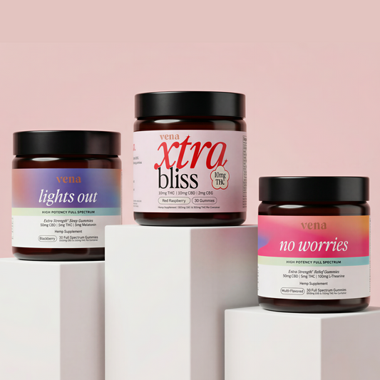 Angled view of three Vena gummy jars labeled lights out, xtra bliss, and no worries on white blocks with pale pink backdrop