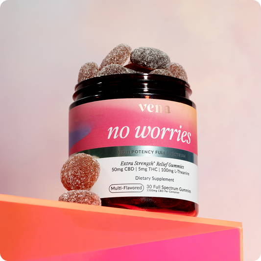 Front view of Vena No Worries extra-strength gummy jar with sugar-coated multi-flavored gummies on a pink gradient background