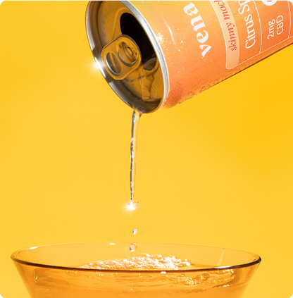 Orange can pouring clear seltzer into a glass; label reads "Skinny mocktails Citrus 2mg CBD"