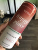 Angled view of Happy Tonix Seltzers can showcasing red ‘Happy Juice’ label and white ingredient panel on a wooden table